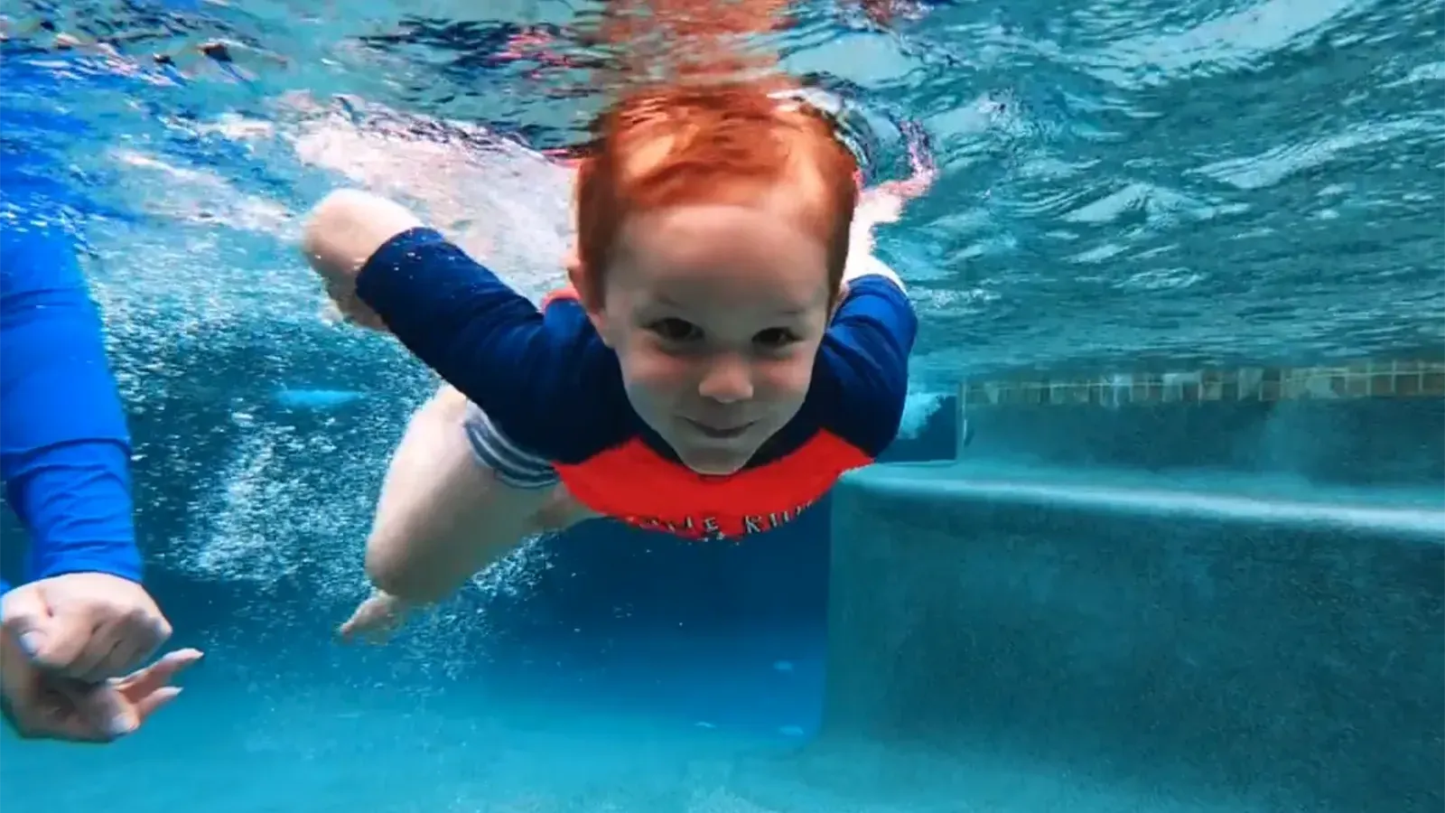 Boy Swimming In Pool